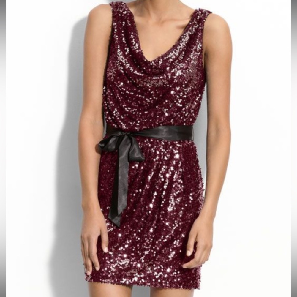 Burgundy sequin Cache cowl neck mini dress with black satin ribbon. Size 4.